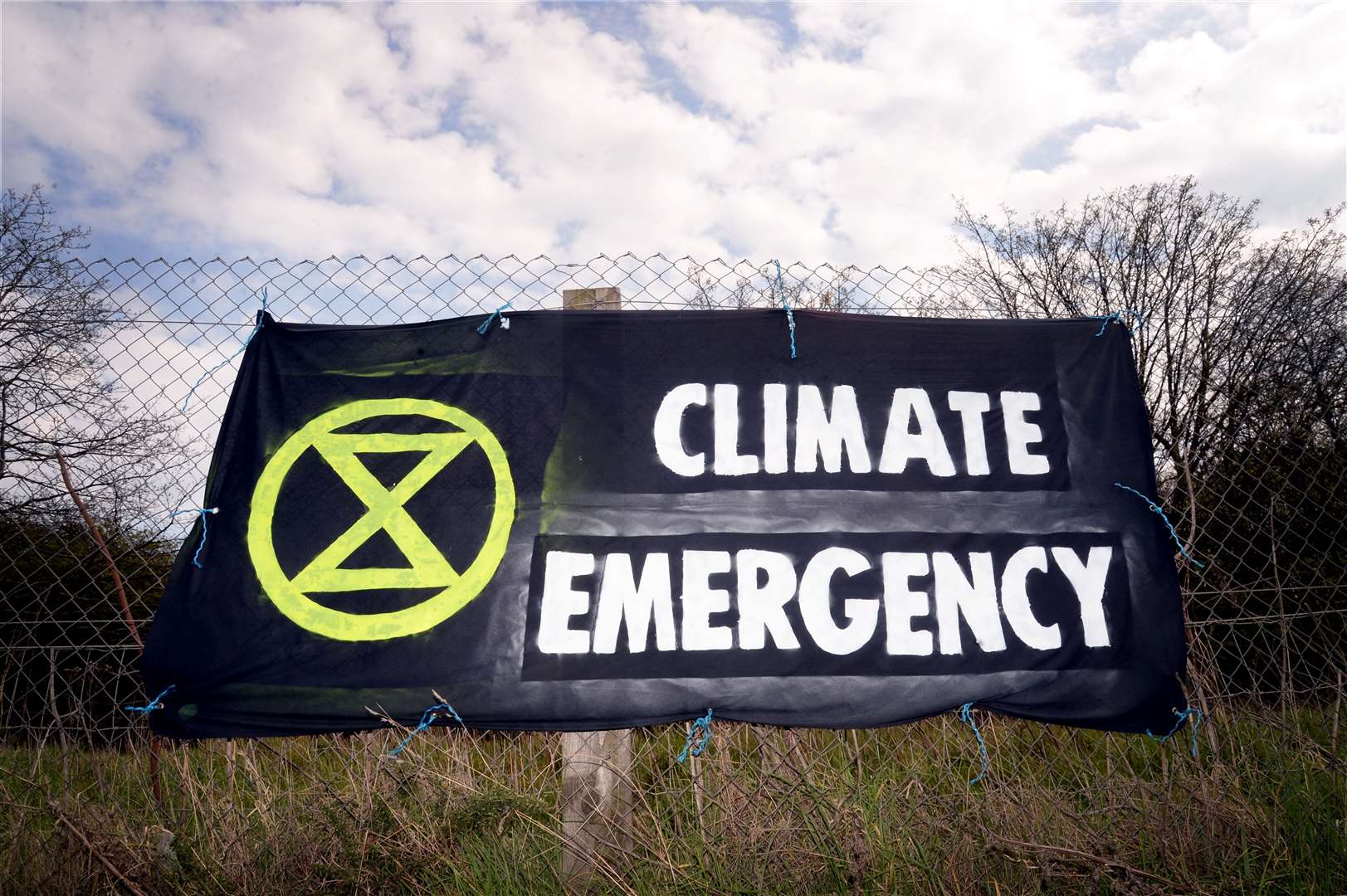 An Extinction Rebellion banner as Friends of the Earth Scotland criticises Scottish councils who have declared a climate emergency yet have pension investments in coal, oil and gas firms.