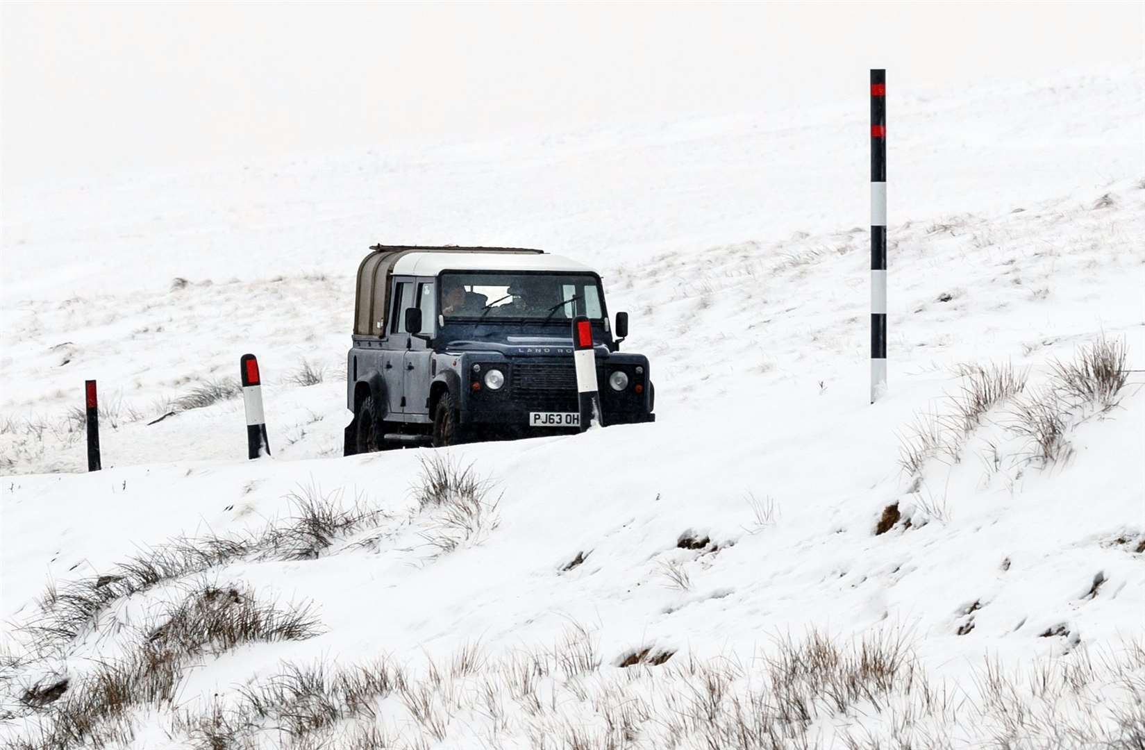 A car navigates the Buttertubs Pass in snowy conditions, near Hawes in North Yorkshire (Danny Lawson/PA)