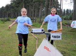 Team-mates Ashleigh Howells (Kinloss) and Kathryn Barr (Dyke) hit the finish.