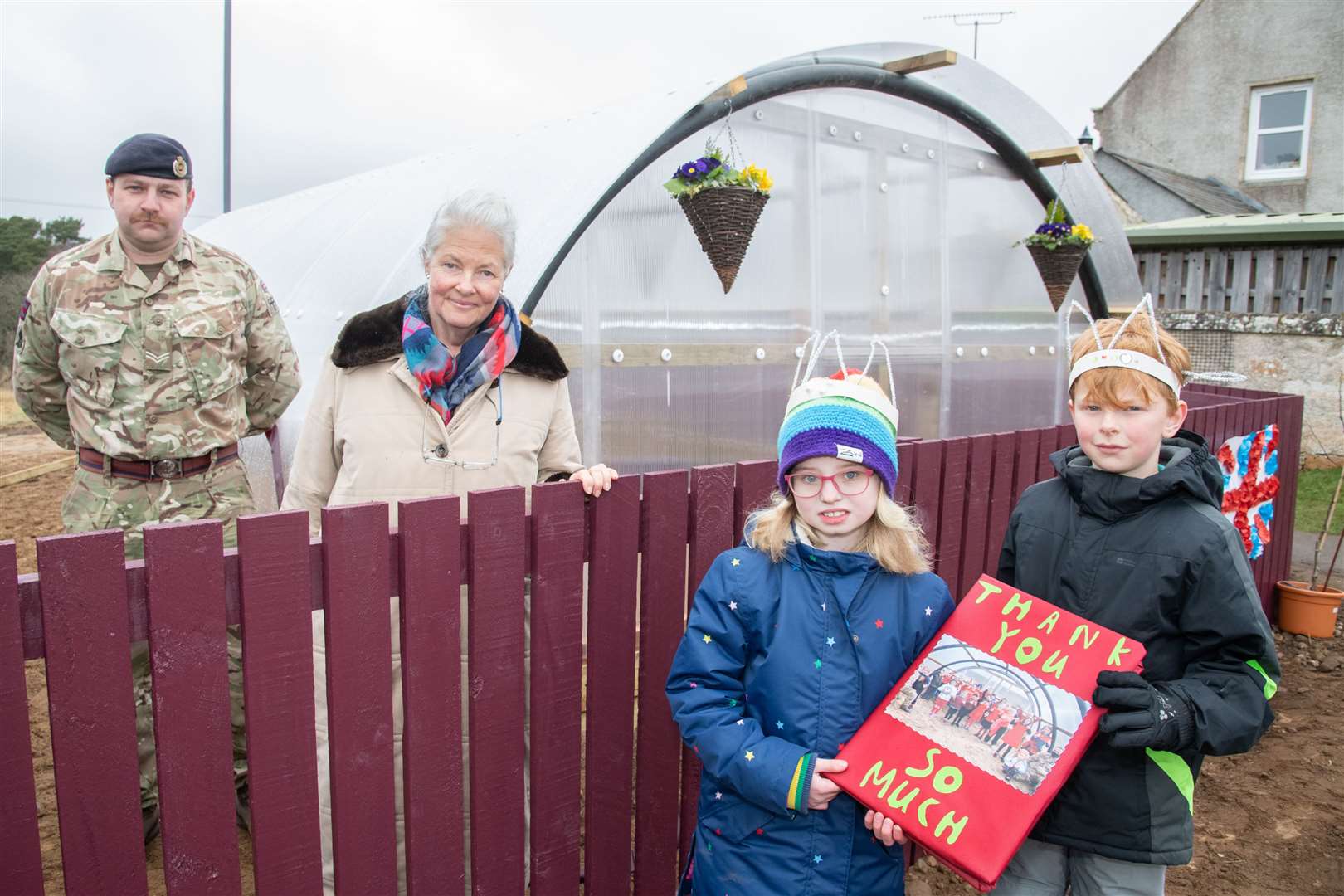 Pupils Aila Gibson and William Grant thanking Poppy Houldsworth and Cpl Robert Grant for their help. Picture: Daniel Forsyth