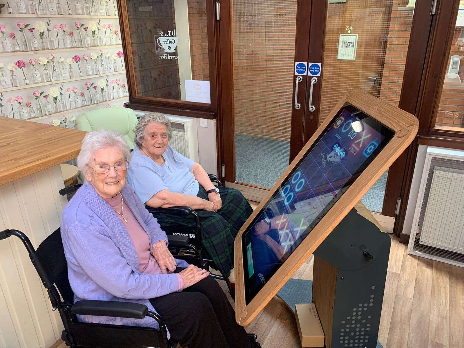 Residents Estelle McPhail and Martha Murray playing noughts and crosses.