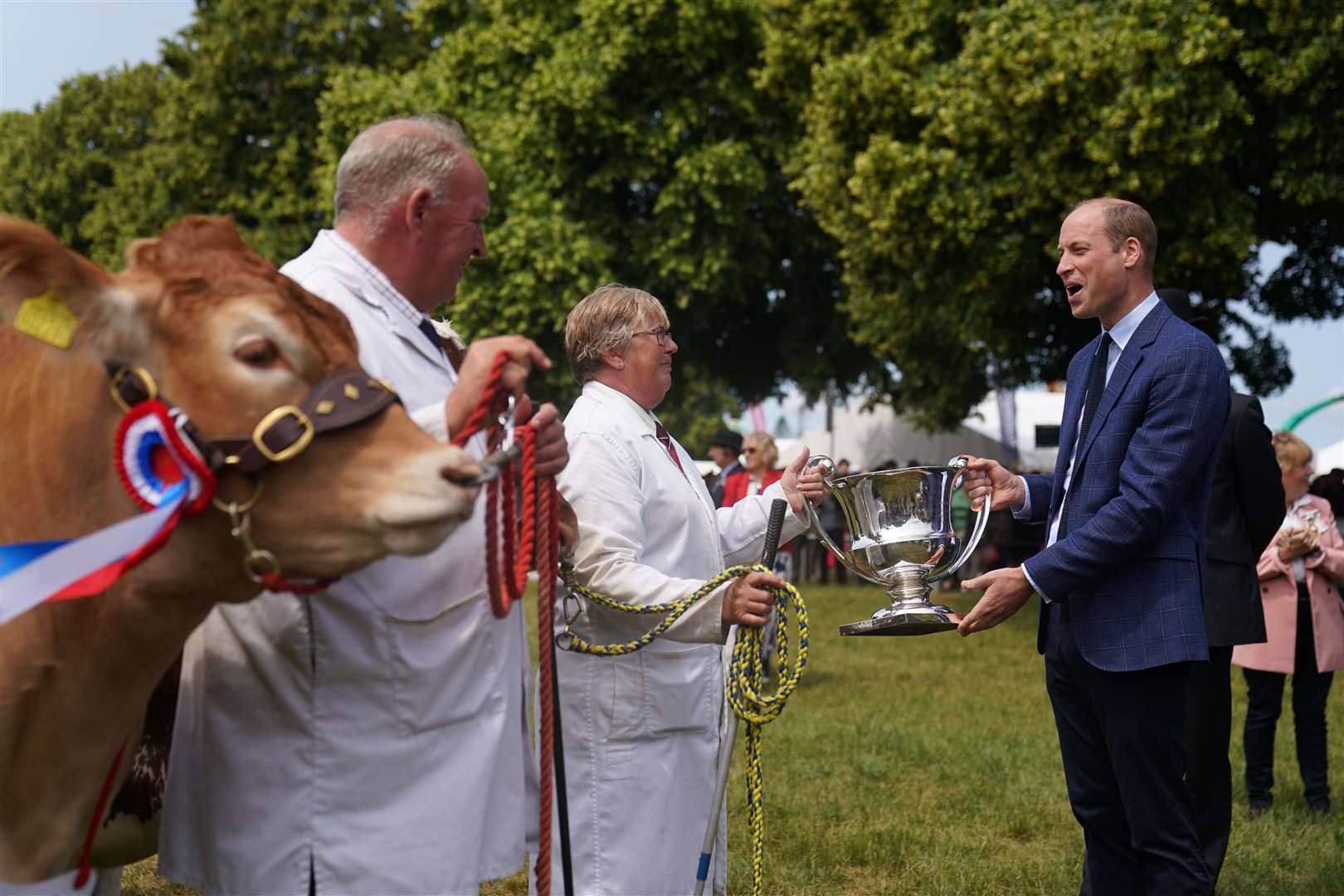 The Prince of Wales hands out awards to cattle handlers as he attends the Royal Norfolk Show at the Norfolk Showground in Norwich (Joe Giddens/ PA)