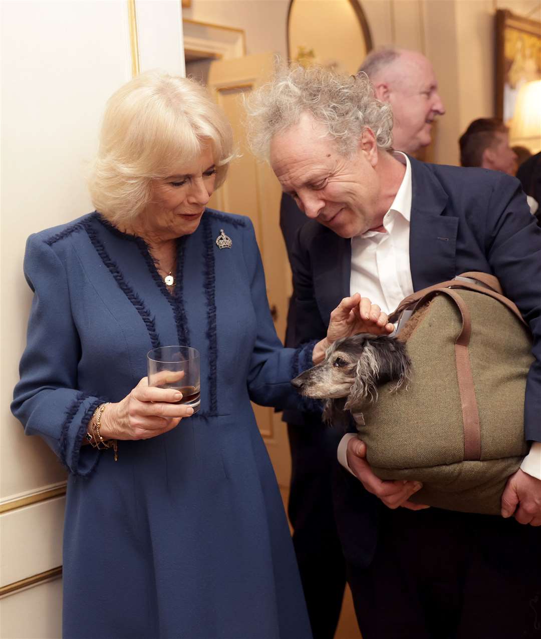 The Queen Consort meets author Charlie Mackesy and his dog Barney (Chris Jackson/PA)