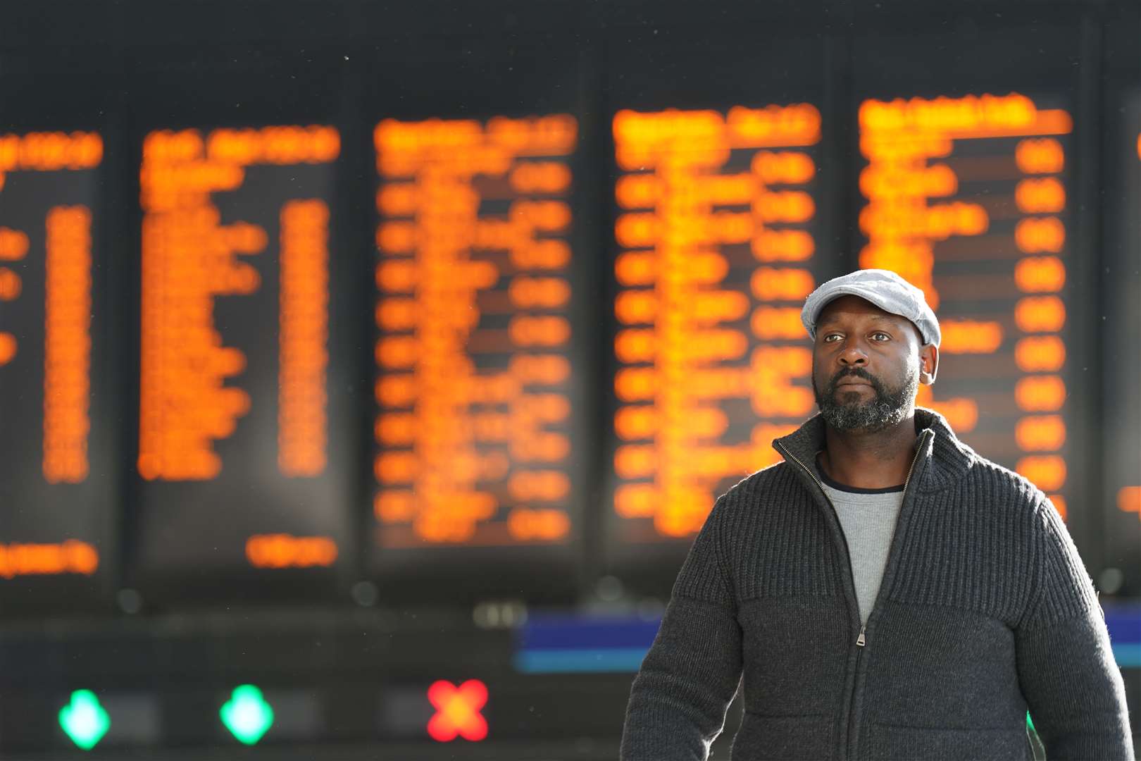 A passenger looks at the travel boards at Waterloo station in London (James Manning/PA)