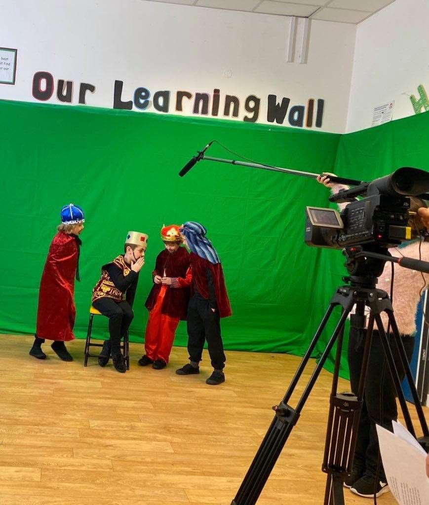 Edison knight (P3), Fergus Ingram (P4), Timmy Edwards (P3), and Lowrie Giblin (P4) in front of the green screen.