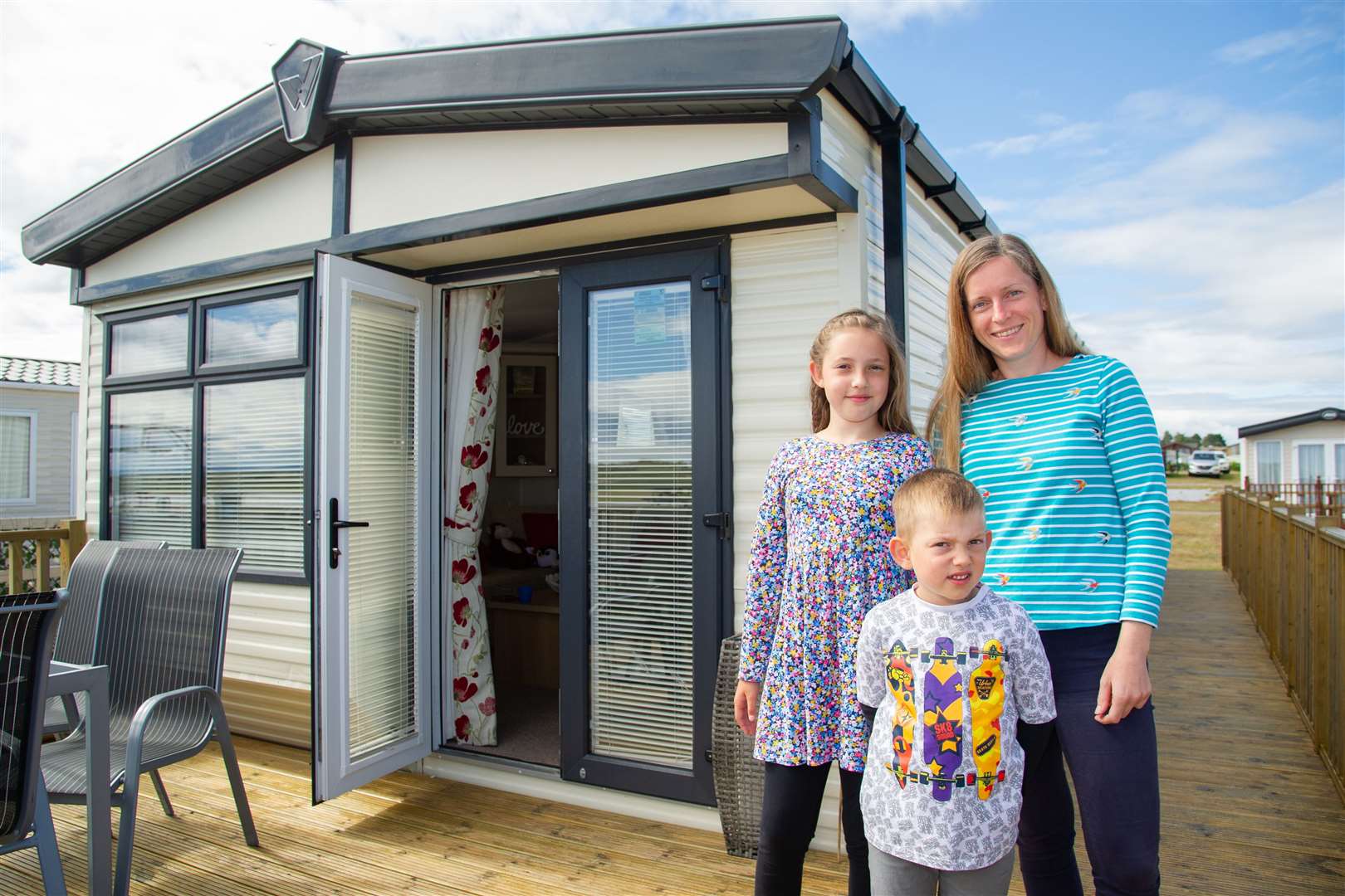 The Rejzner family, from Inverurie, the first family to stay at the Logan's Fund Sunny Days caravan in Lossiemouth following the coronavirus lockdown – mum Iwona with children Olaf and Maria. Picture: Daniel Forsyth.