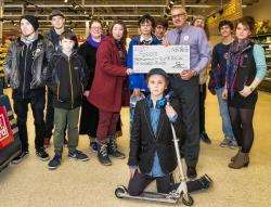 Forres Skatepark Steering Group accepting a cheque for £500 from Forres Tesco manager Mark Drivers.