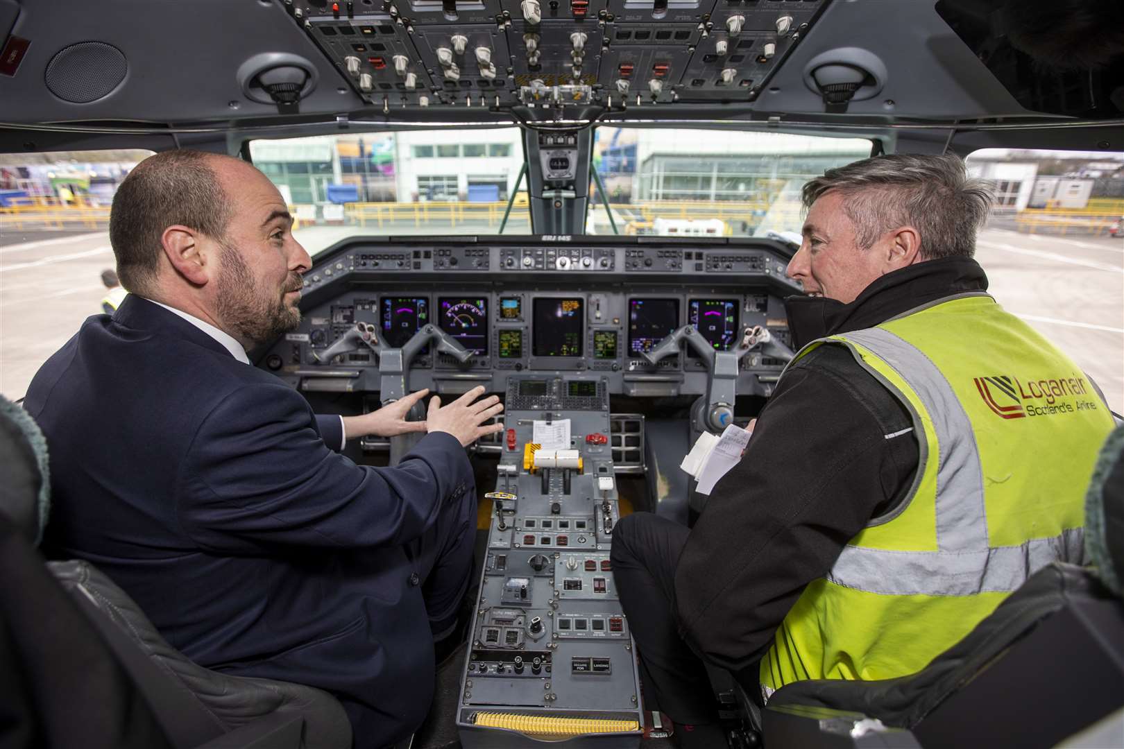 Mr Holden with Loganair co-pilot Michael McGready (Liam McBurney/PA)