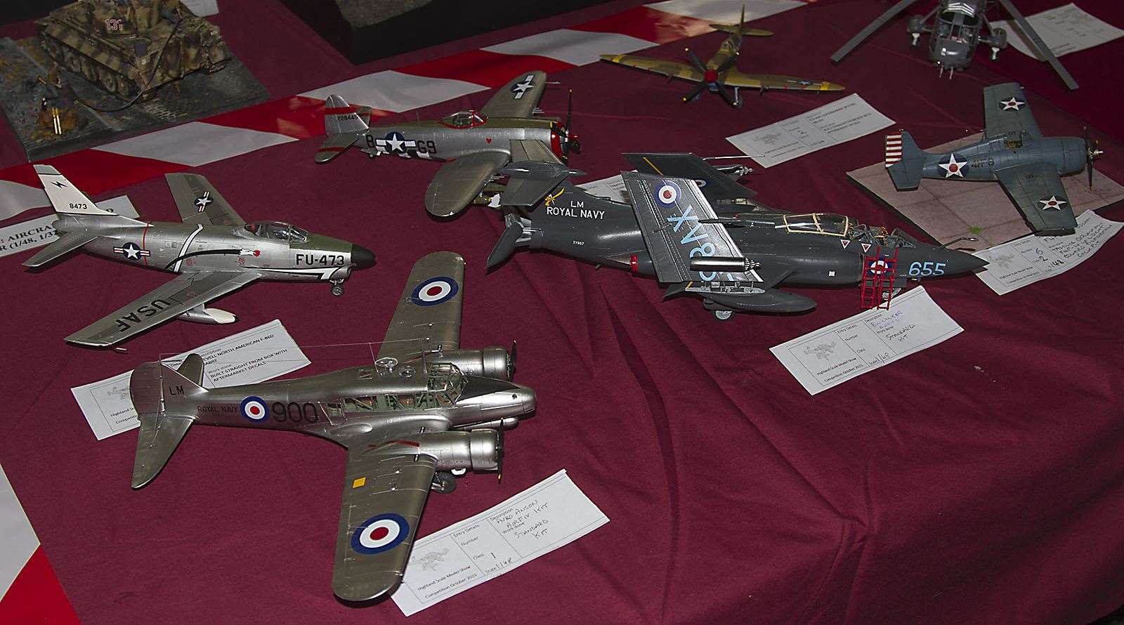 A section of the Kinloss and Forres Model Club display including an Avro Anson, North American F-86D Sabre, Republic P-47D Thunderbolt, Blackurn Buccaneer, Grumman Wildcat and Supermarine Spitfire.