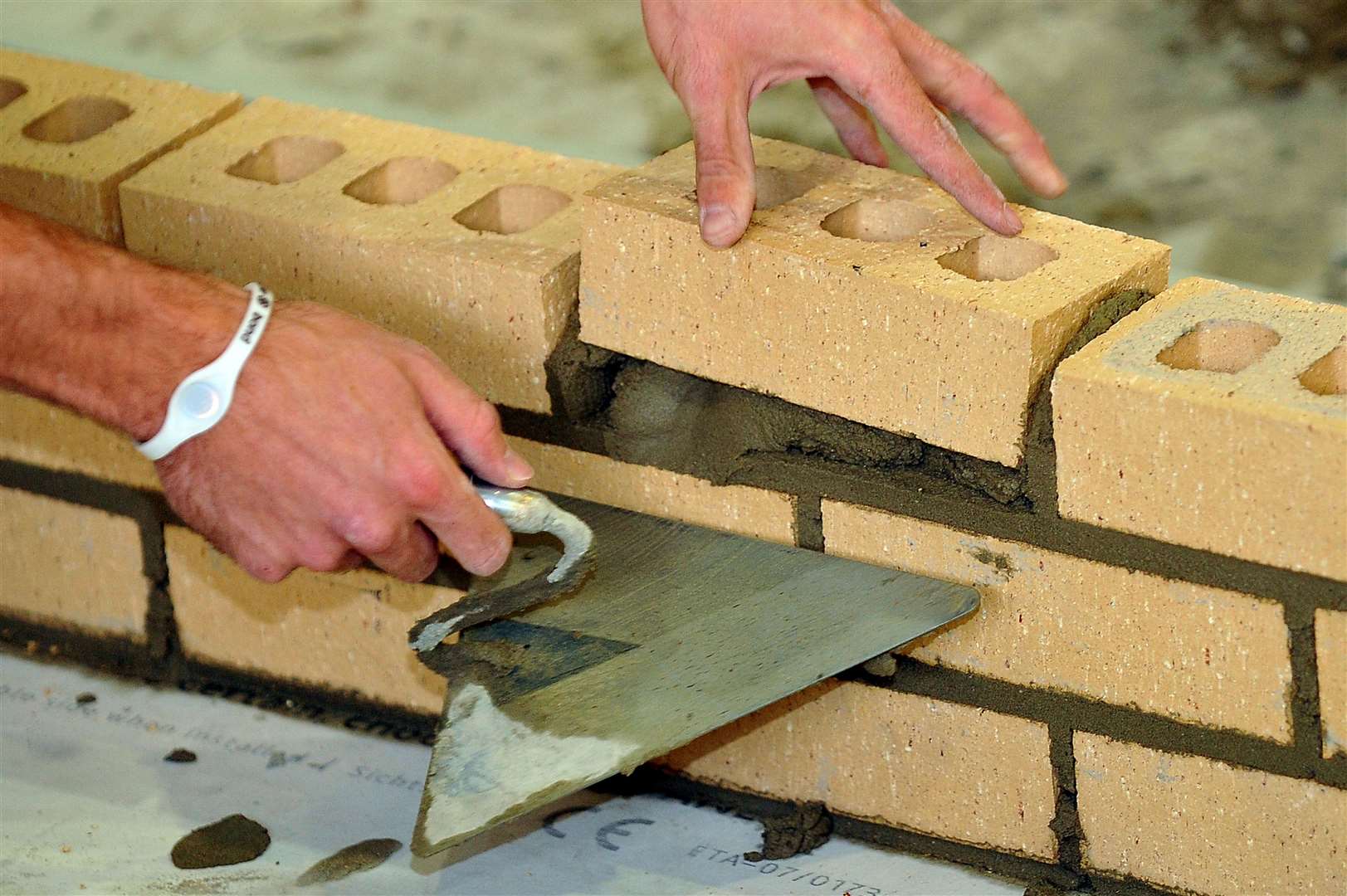 A trainee bricklayer at work (Ian Nicholson/PA)