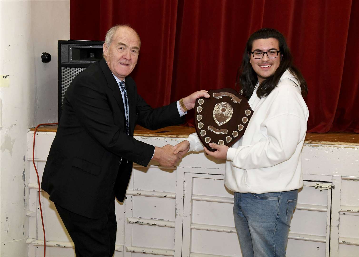 FCAA chairman George Alexander awarding Forres Academy student Ben Stewart with the Forres Community Activities Association Youth Shield last year. Picture: Beth Taylor