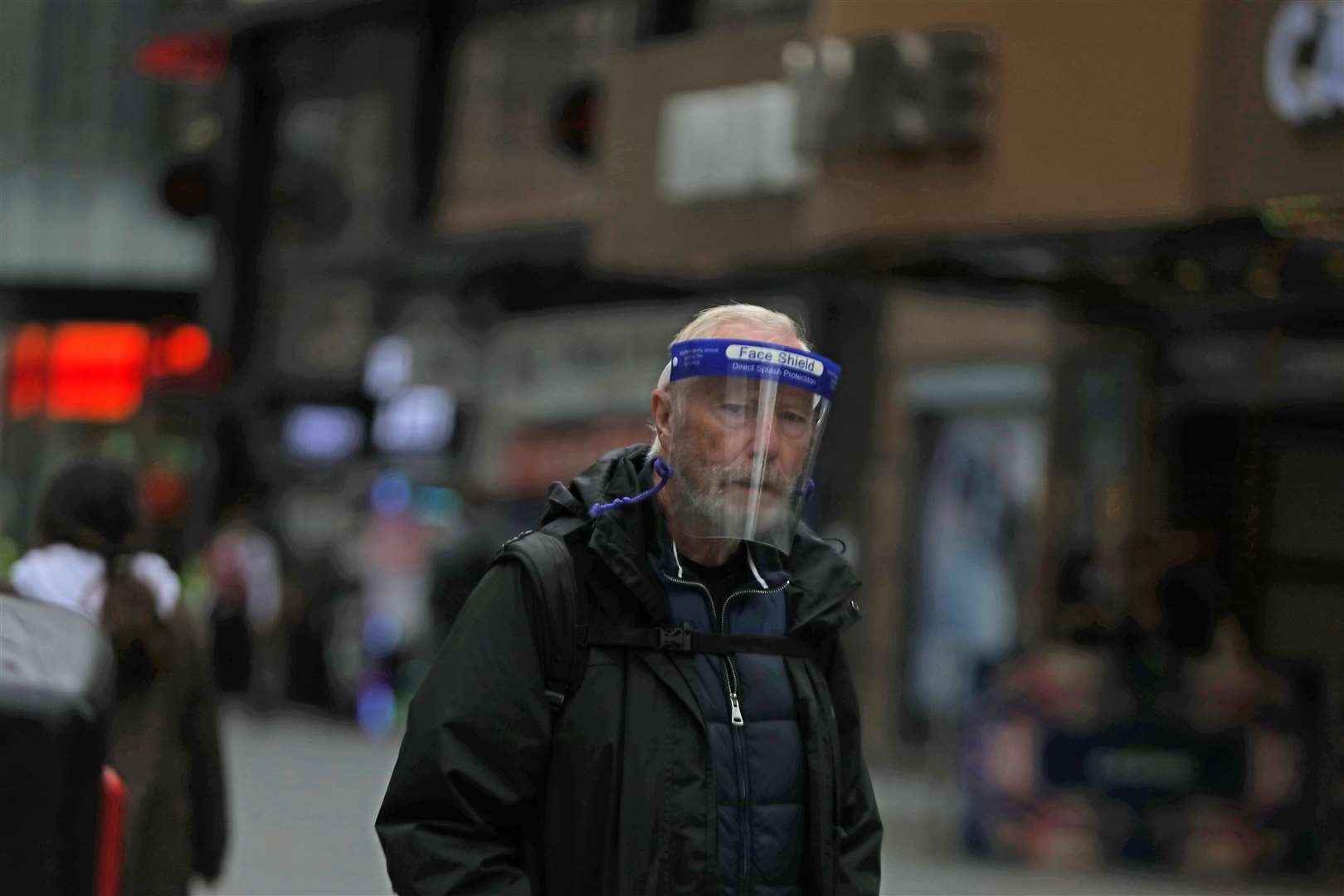 A man wearing a face shield in London’s Oxford Street (Luciana Guerra/PA)