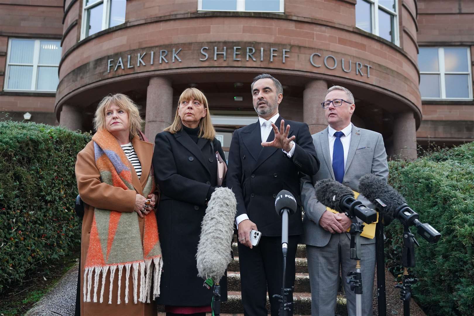 Aamer Anwar, second right with, left, Deborah Coles, of bereavement charity Inquest and Linda and Stuart Allan, the parents of Katie Allan, outside Falkirk Sheriff Court (Andrew Milligan/PA)