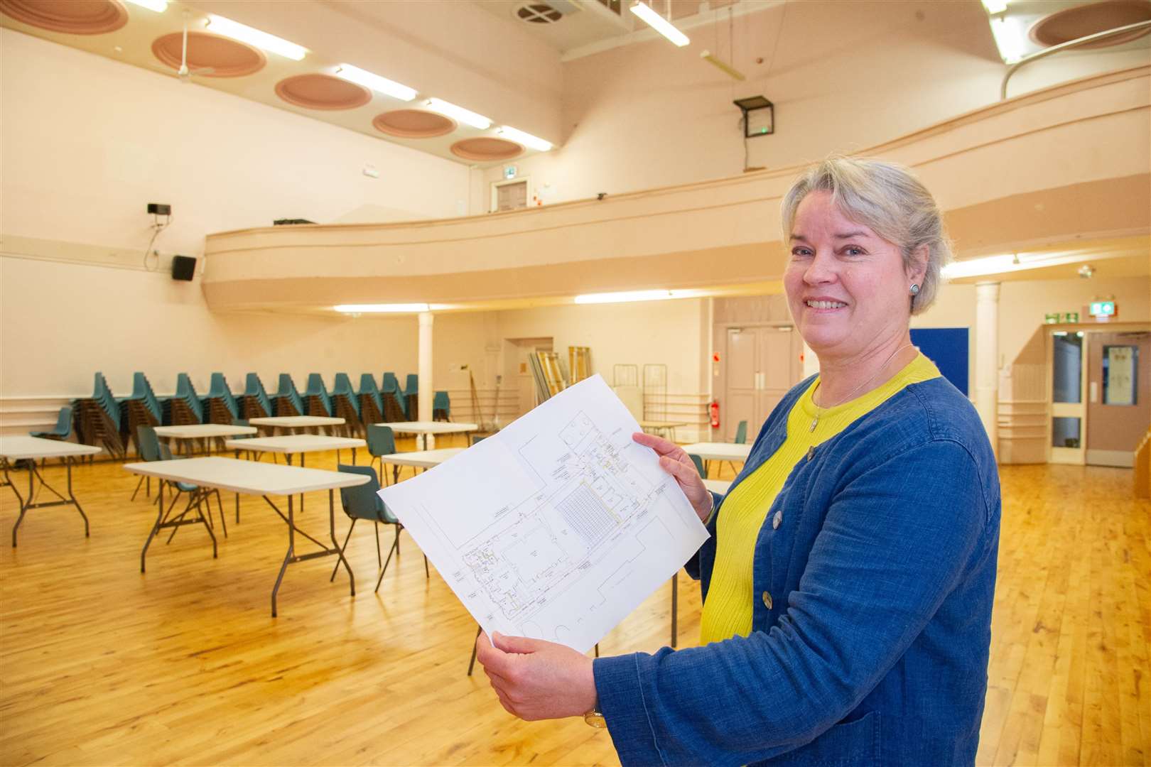 FACT's town hall project officer, Jan MacPherson, with the plans for the extensive renovations.