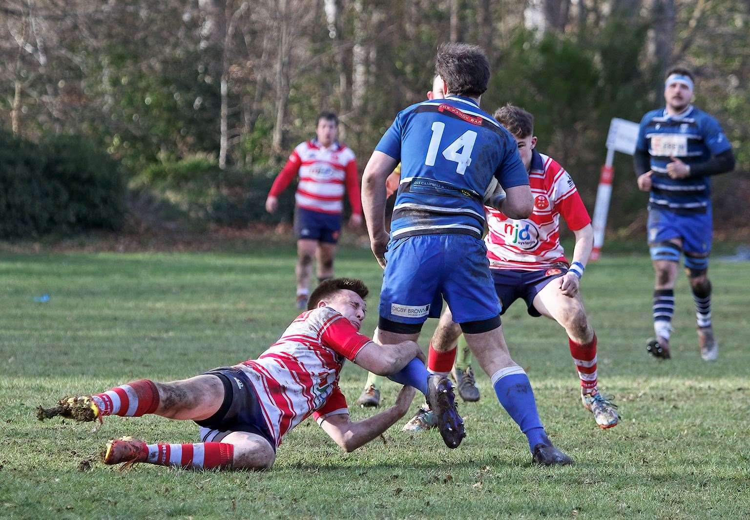 Ben Taylor tries to hold on to leg of wing. Lewis Hay lining up tackle. Picture: John MacGregor