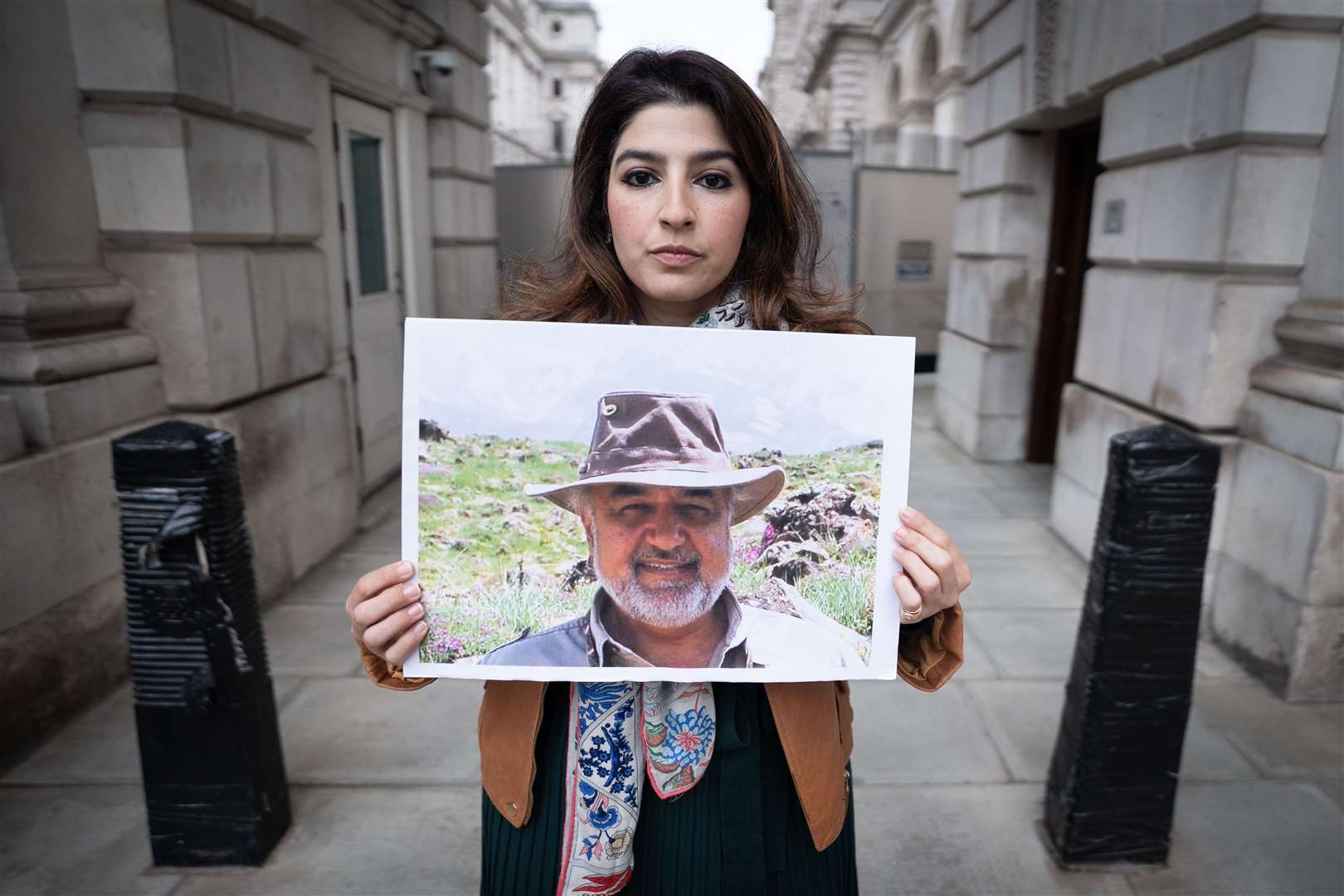 Roxanne Tahbaz, holds a picture of her father Morad Tahbaz (Stefan Rousseau/PA)