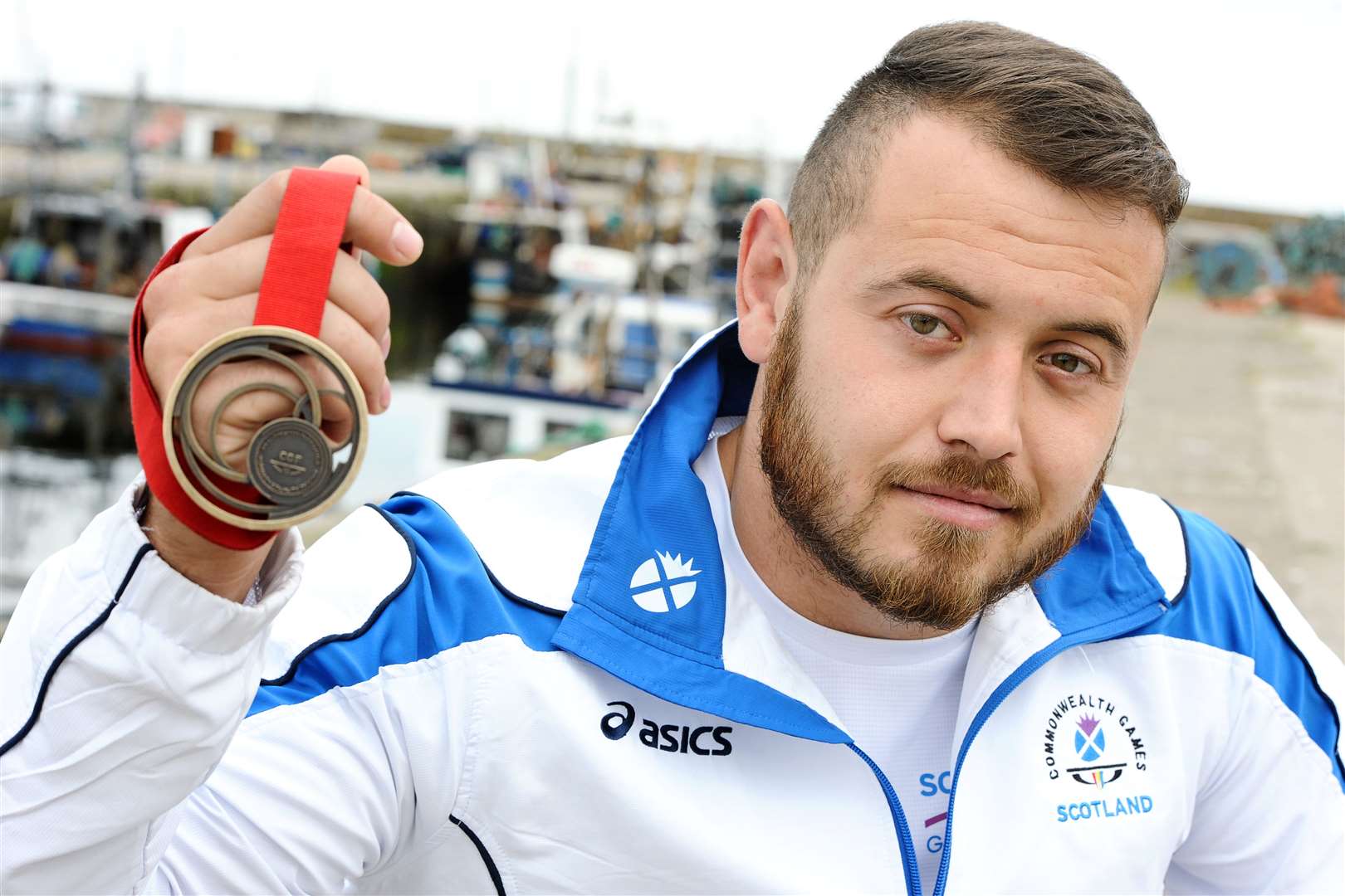 Back in Burghead with his Commonwealth Games medal from 2018, Mark Dry wants another shot at glory – but needs help. Picture: Daniel Forsyth