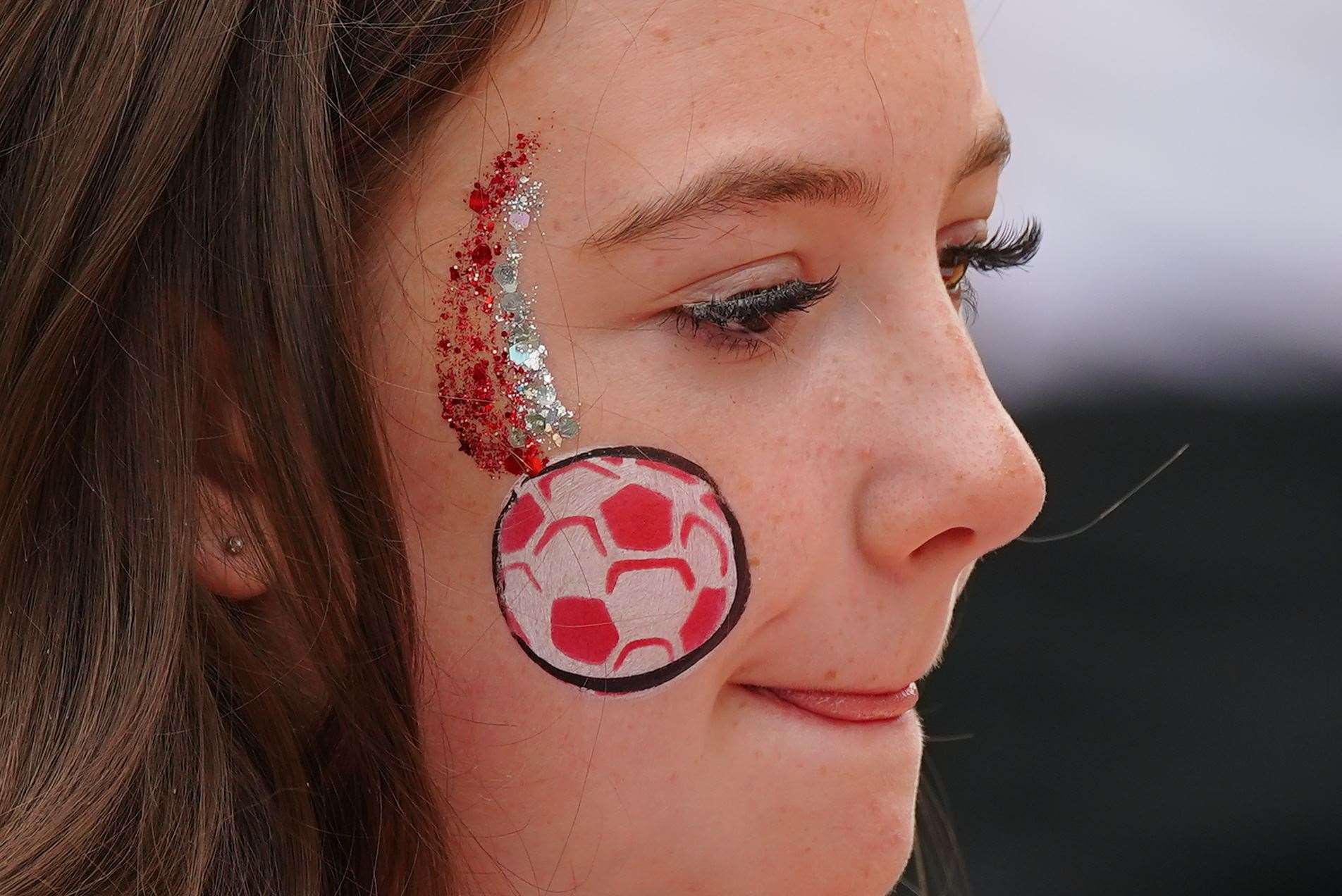 An England fan waits for the start of a screening of the final at Piccadilly Gardens, Manchester (Peter Byrne/PA)