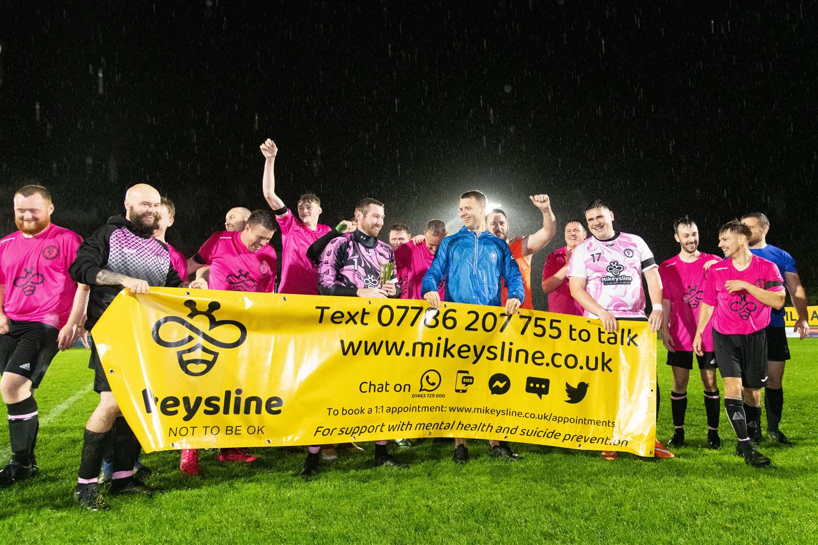 We are the champions. Moray Mental Health FC lift the Mikeysline Cup.