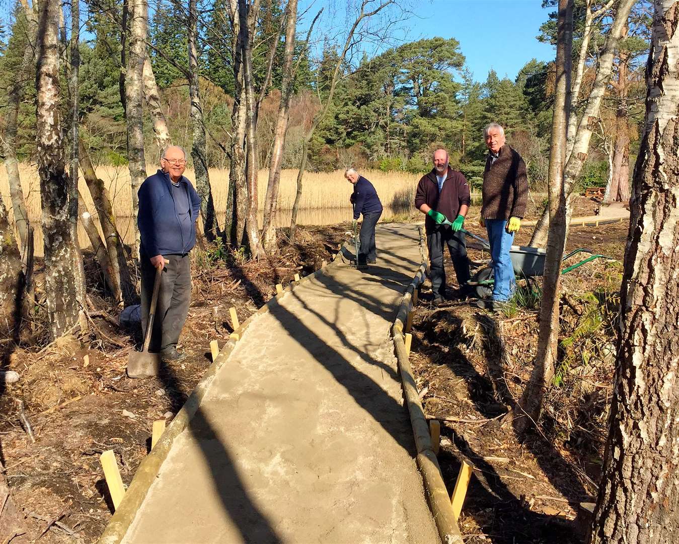 Volunteers Mike Holder, Julia Mackay, Colin Mackay and Richard Jordon working on a new walkway.