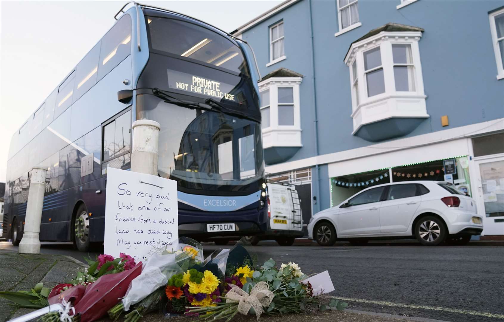 Flowers were left at the entrance at Portland Port in Dorset, following the death (PA)