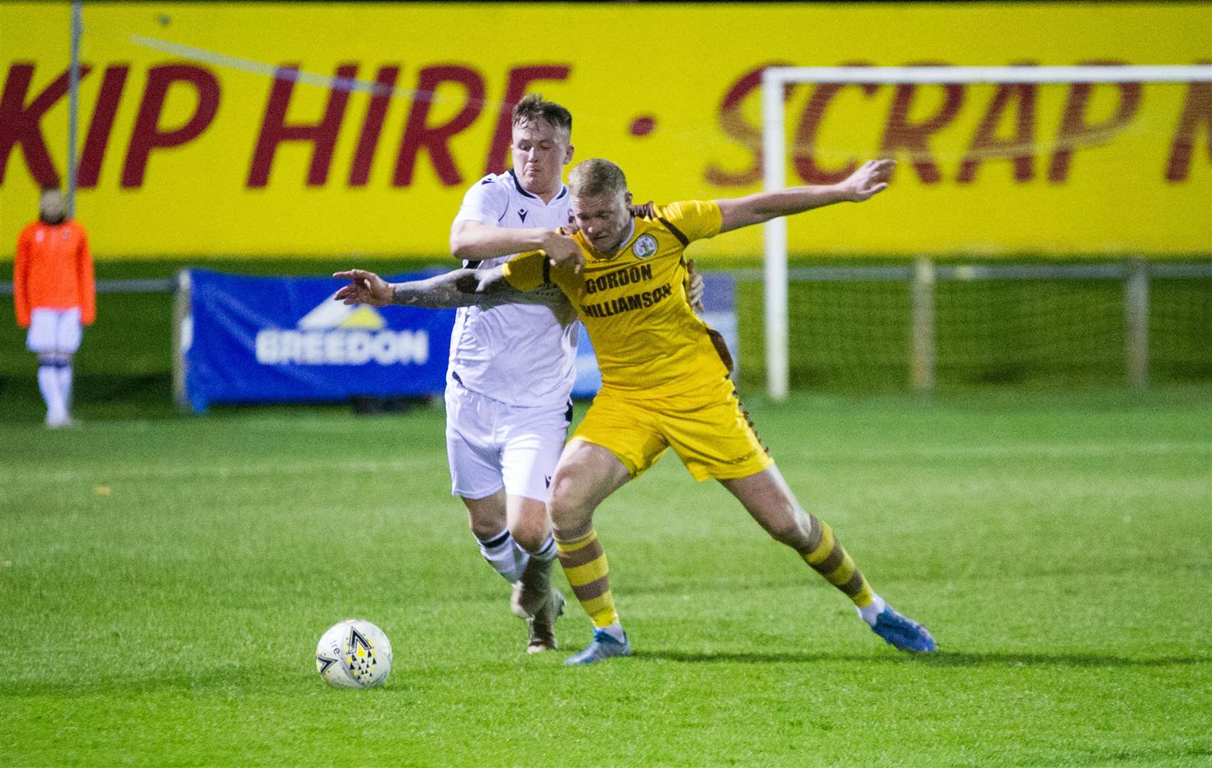Ryan McRitchie challenges Forres’ Lee Fraser during his time at Rothes. The centre back now makes Mosset Park his home.