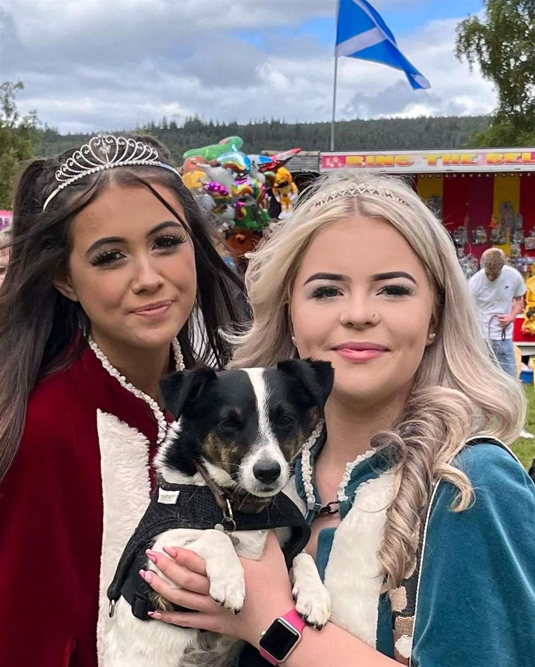 Gala Queen Chloe Dey (left) and attendant Anna Park with the Pet Parade winner Digger. Picture: Daniel McLauchlan