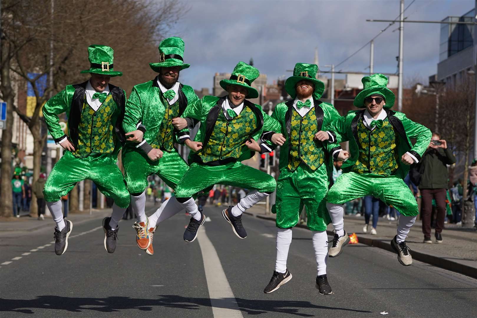 Spectators get in the mood ahead of the 2022 St Patrick’s Day Parade in Dublin after the event was cancelled the previous two years (Brian Lawless/PA)