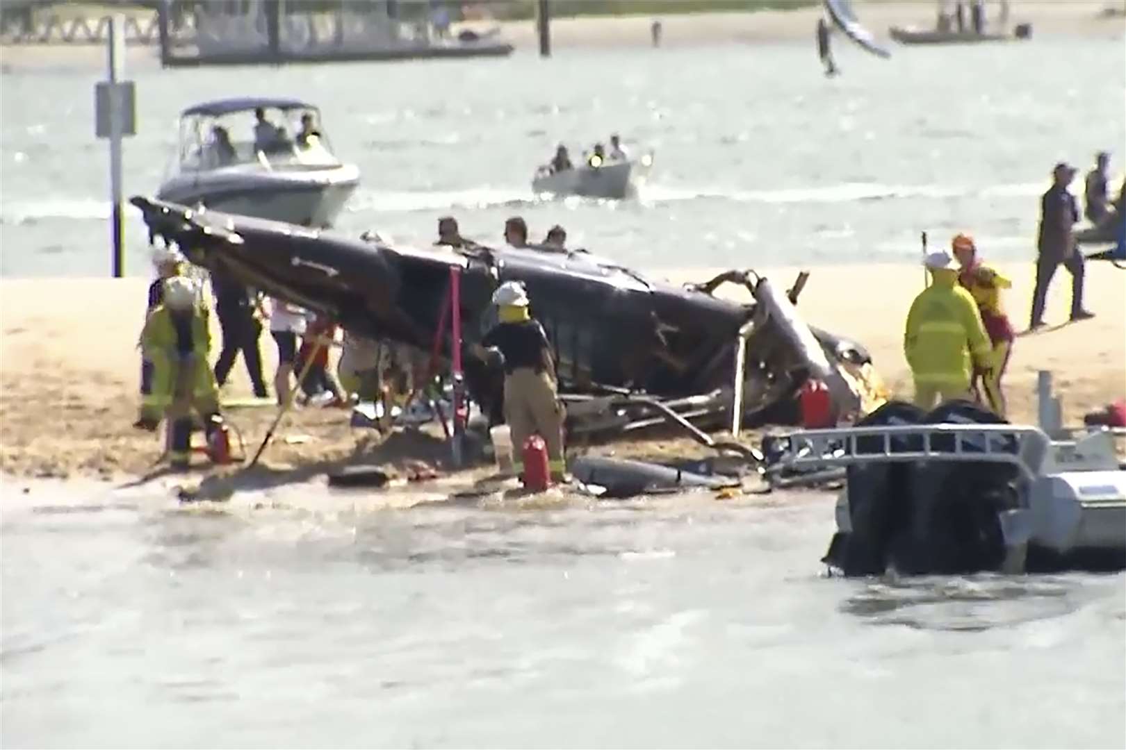 The crashed helicopter on Main Beach on the Gold Coast (CH9/AP)