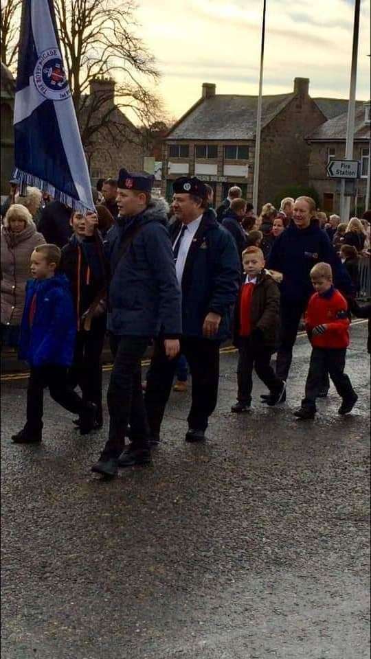Last year's Remembrance service parade with the batallion's senior boy, Callum Machray, carrying the colours.