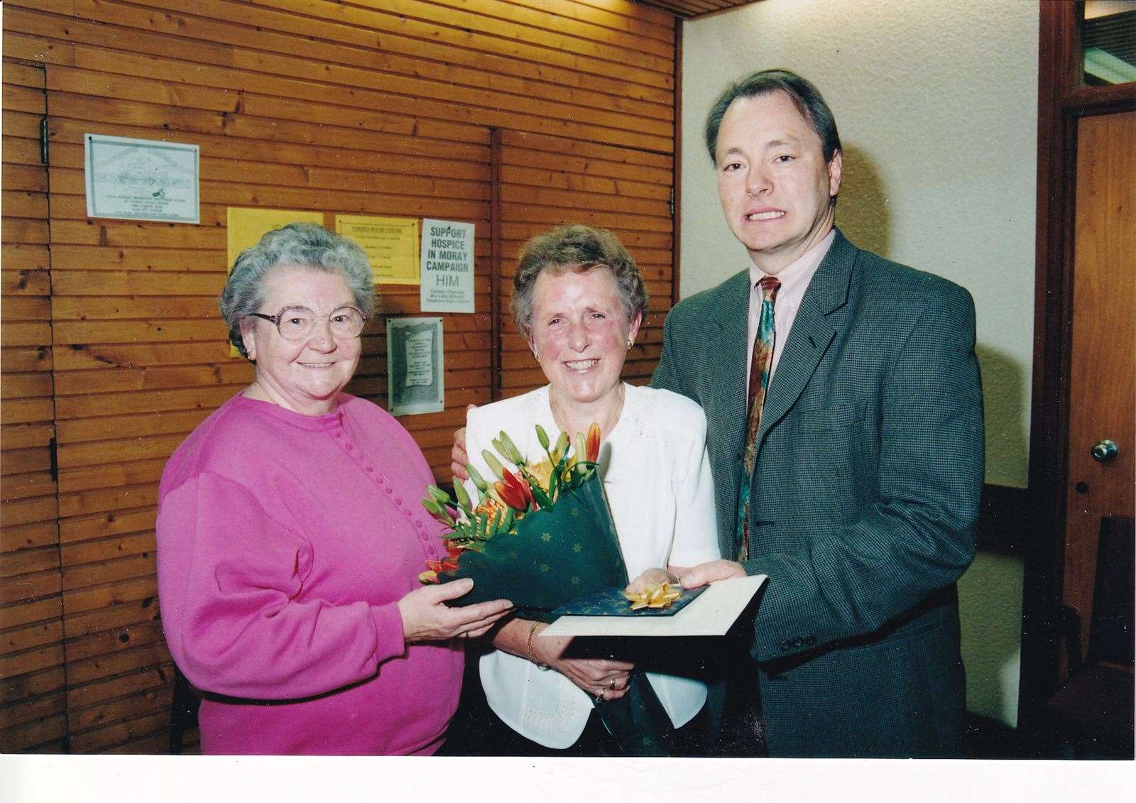 The late Betty Sutherland (left) giving flowers to Jean Mcintosh. They were both cleaners at the Centre.