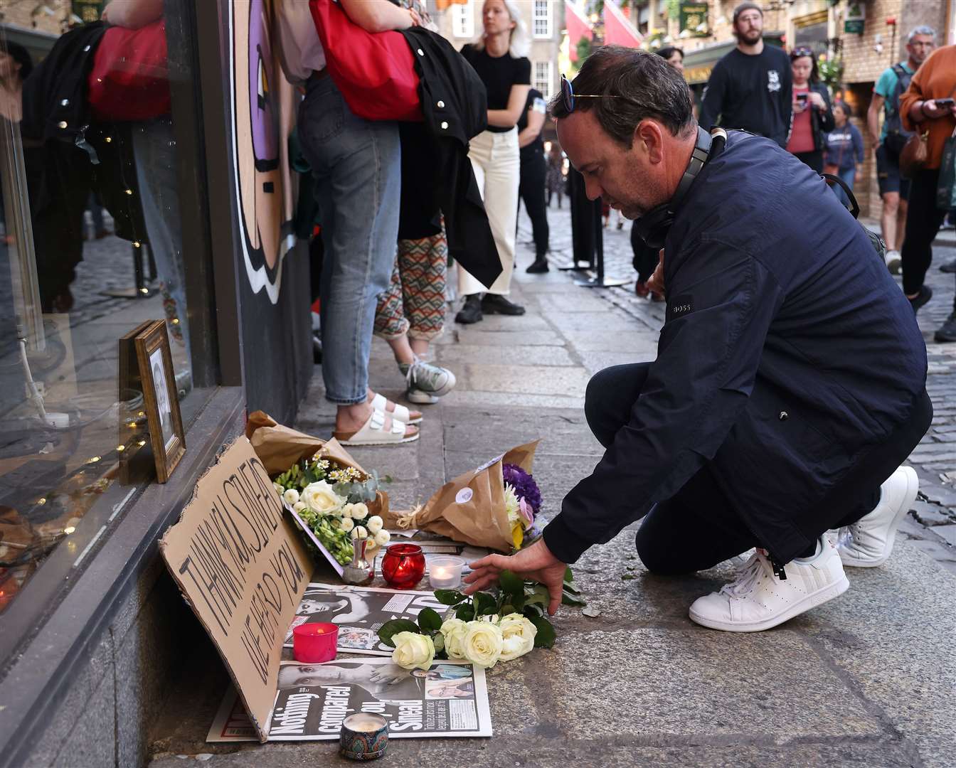 In Dublin, dozens of people gathered outside the Wall of Fame to pay their respects to O’Connor (Damien Eagers/PA)