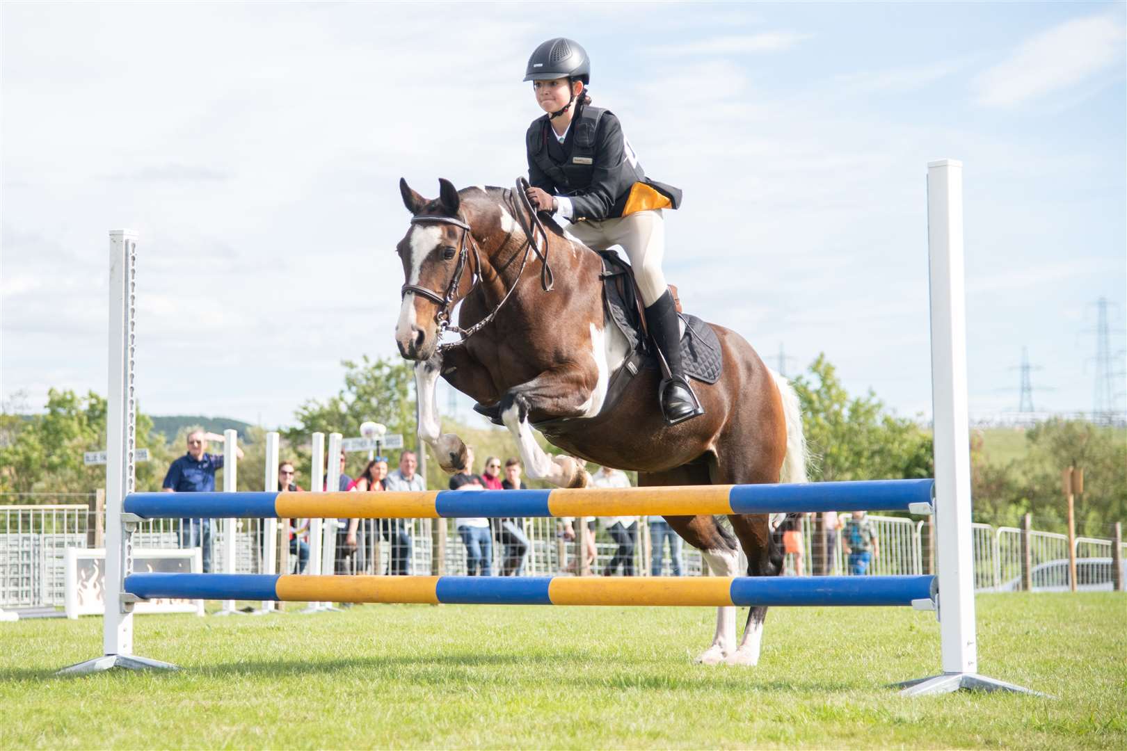 Show jumping action.