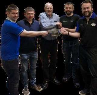 Bill Nicol (centre) presents the Nicol Quaich to the winning rink (from left) Grant Fraser, Neil MacArthur, Ali Fraser (skip) and Dean Clark.