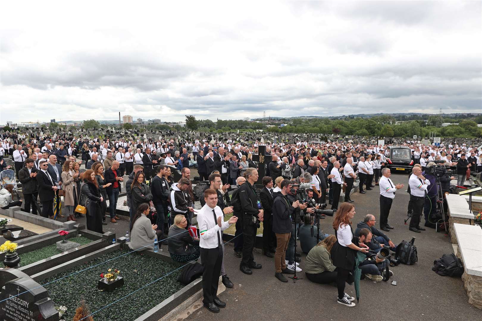 A crowd listens to former Sinn Fein president Gerry Adams speak during the funeral of Bobby Storey at Milltown Cemetery in west Belfast (Liam McBurney/PA)
