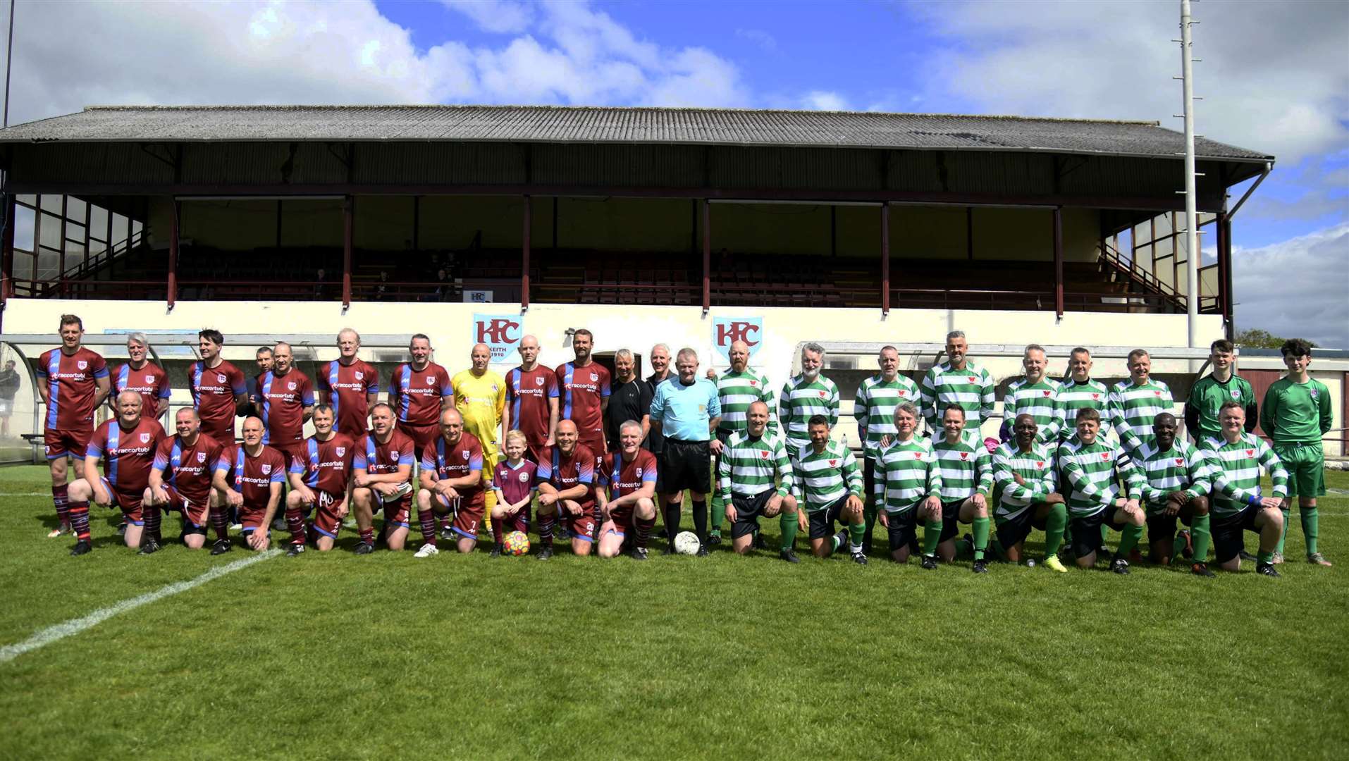 Both sets of teams line up for the Gogs Younie testimonial match at Kynoch Park, Keith, which raised over £13,000 for charity. Picture: Becky Saunderson..