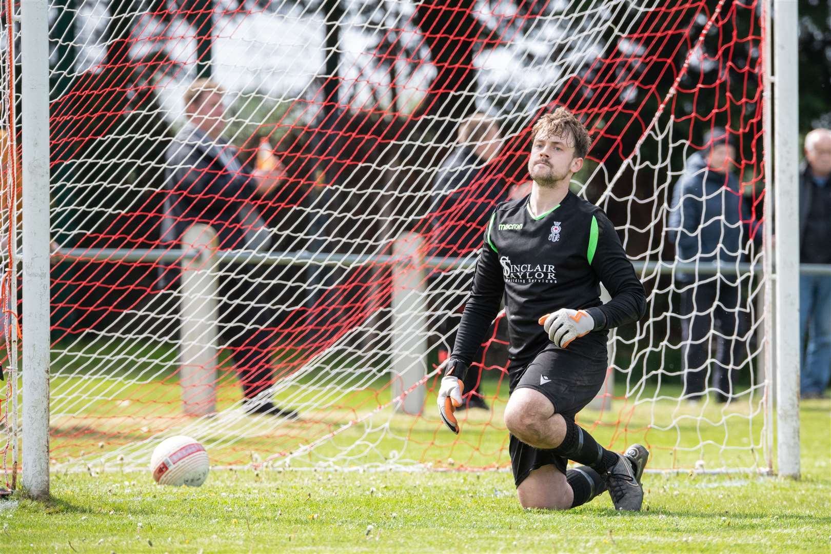Forres goalkeeper Daniel McLeod is left gutted after the penalty shootout. Dufftown FC (2) vs Forres Thistle FC (2) - Dufftown FC win 5-3 on penalties - Elginshire Cup Final held at Logie Park, Forres 14/05/2022...Picture: Daniel Forsyth..