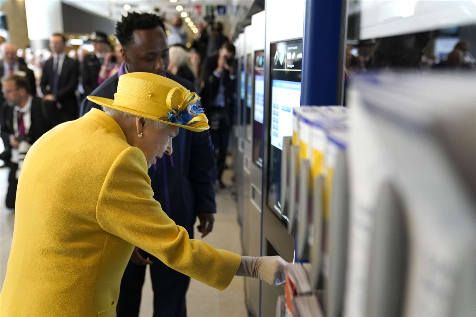 The Queen using an oyster card machine at Paddington station (Andrew Matthews/PA)
