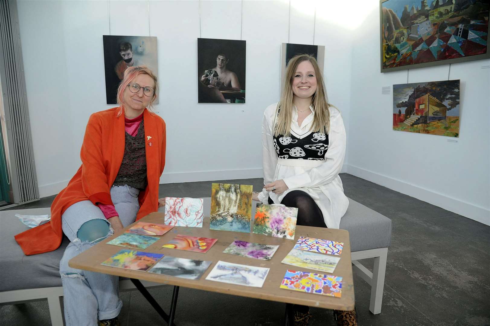 MAC board member Lucy Summers and artist Leah Davis with some of the colourful submissions that have been received so far.