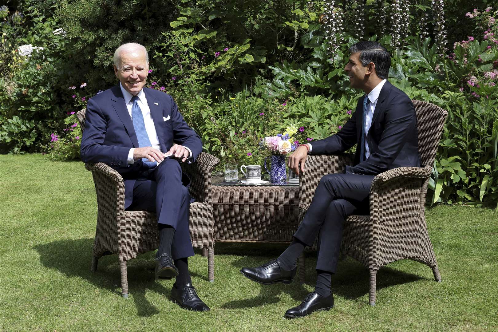 Mr Sunak and Mr Biden posed for pictures in the Downing Street garden (Suzanne Plunkett/AP)