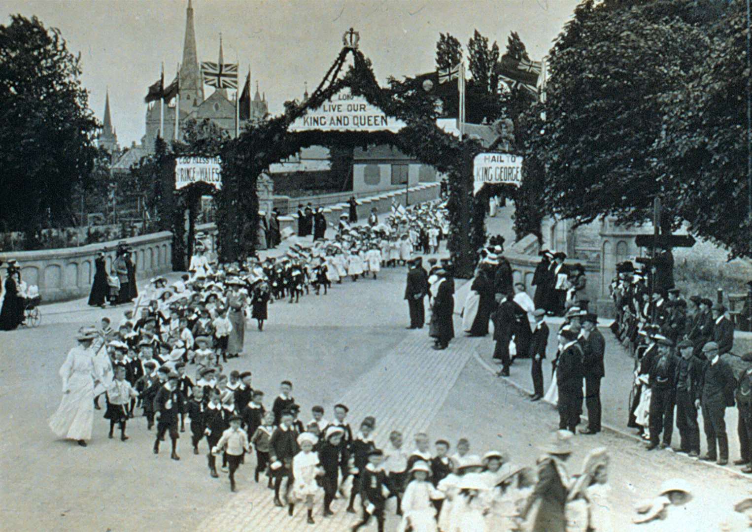 A parade over Bridge Street to Roysvale Park for the Coronation of King George V and Queen Mary on June 22, 1911.