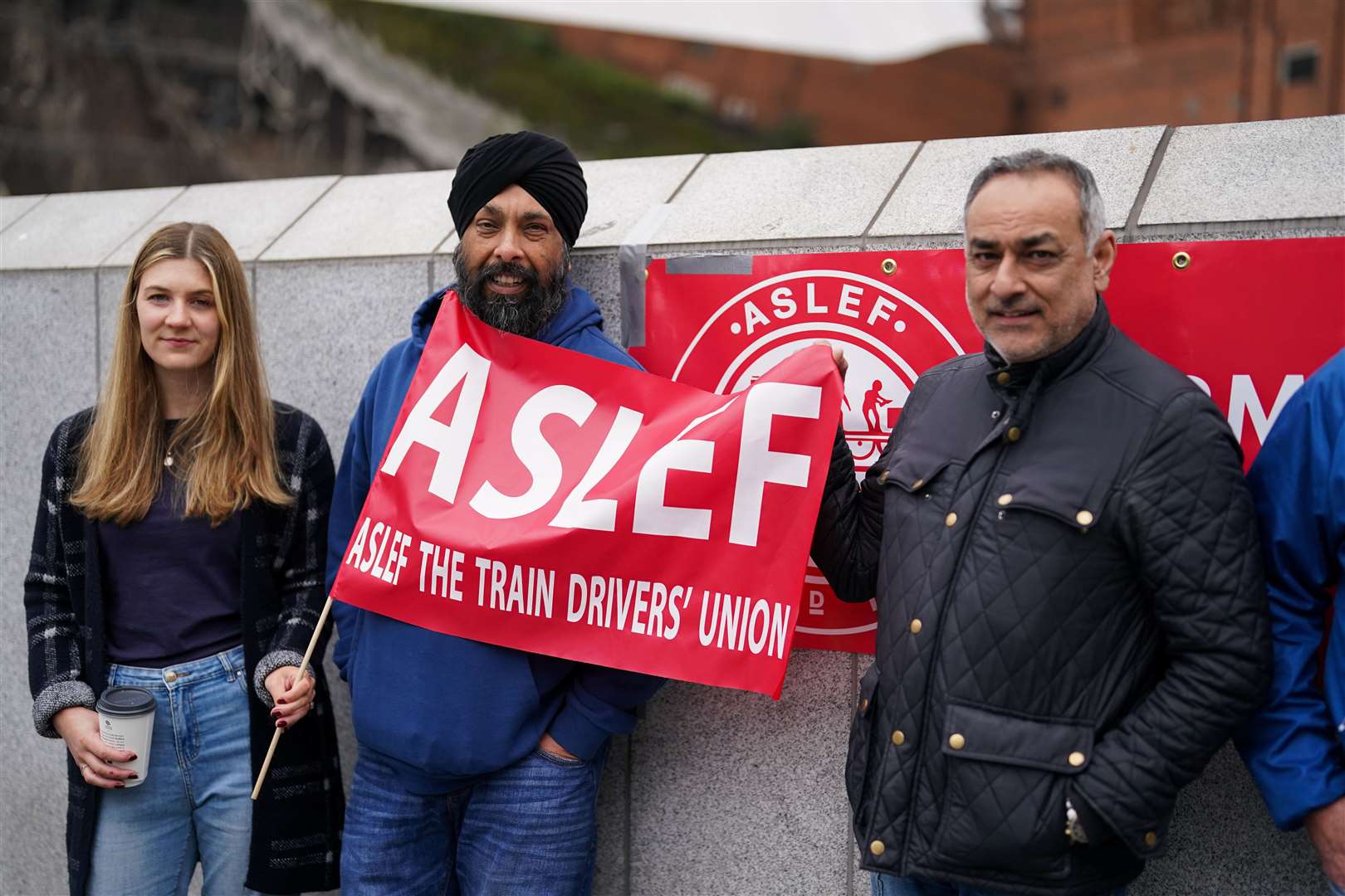 Members of the drivers’ union Aslef on the picket line at New Street station in Birmingham (Jacob King/PA)