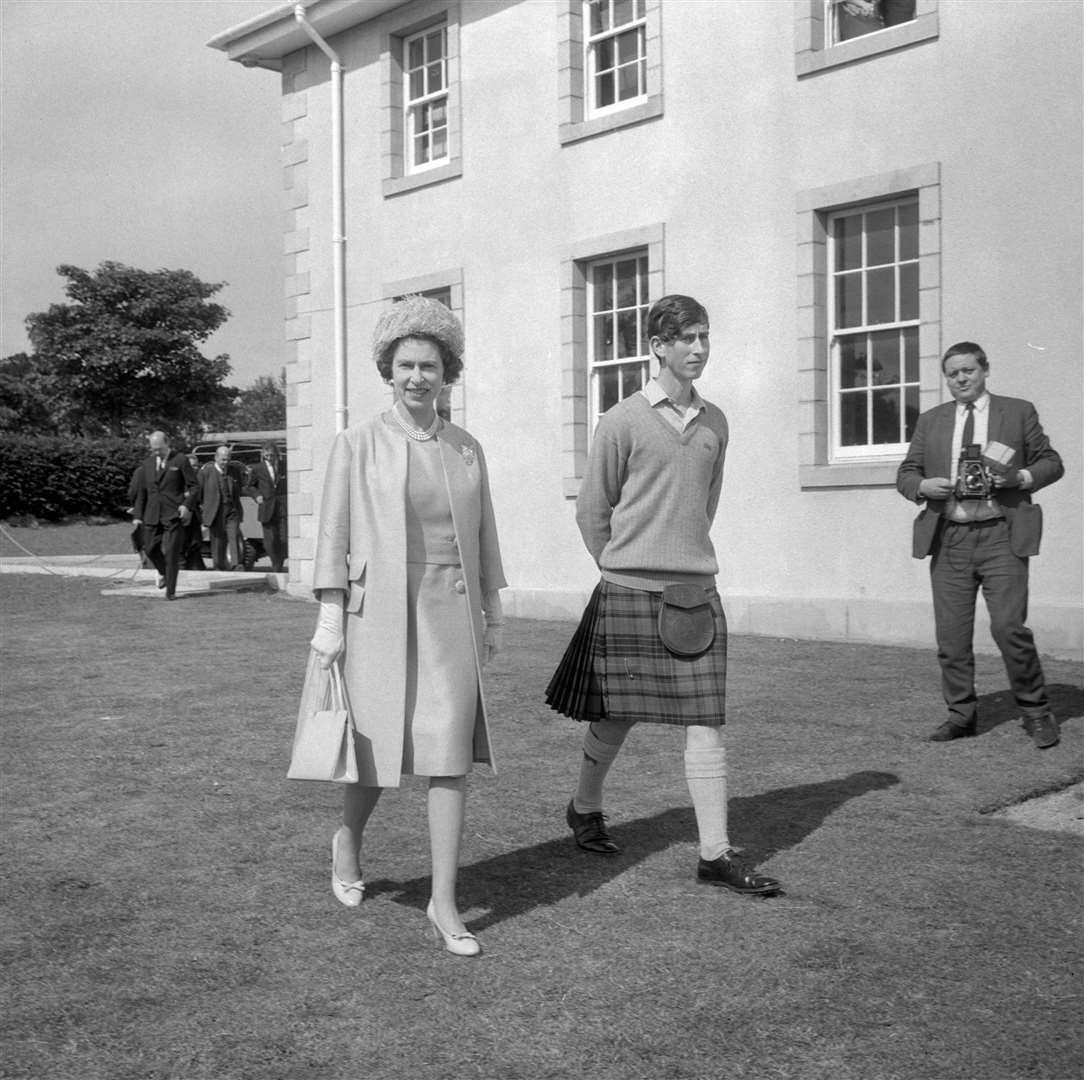 The Queen at Gordonstoun School to open the new sports centre, accompanied by her son the Prince of Wales who was the school’s guardian – head boy (PA)