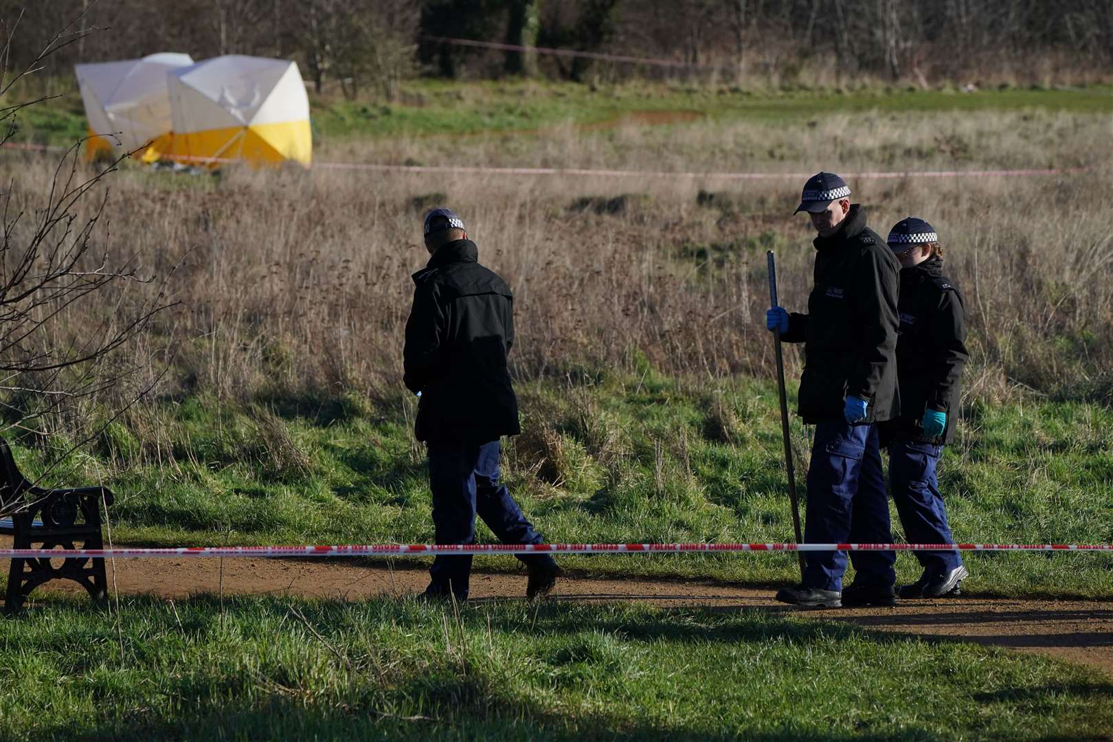 Forensic tents and a police search team carried out investigations at the scene (Jonathan Brady/PA)
