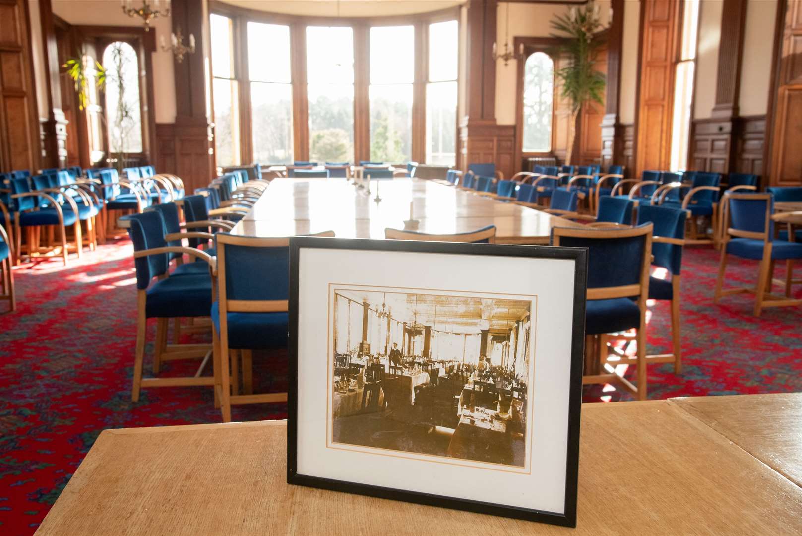 The spacious dining room and a Victorian-era picture of how it was when the building was a hydropathic hotel.
