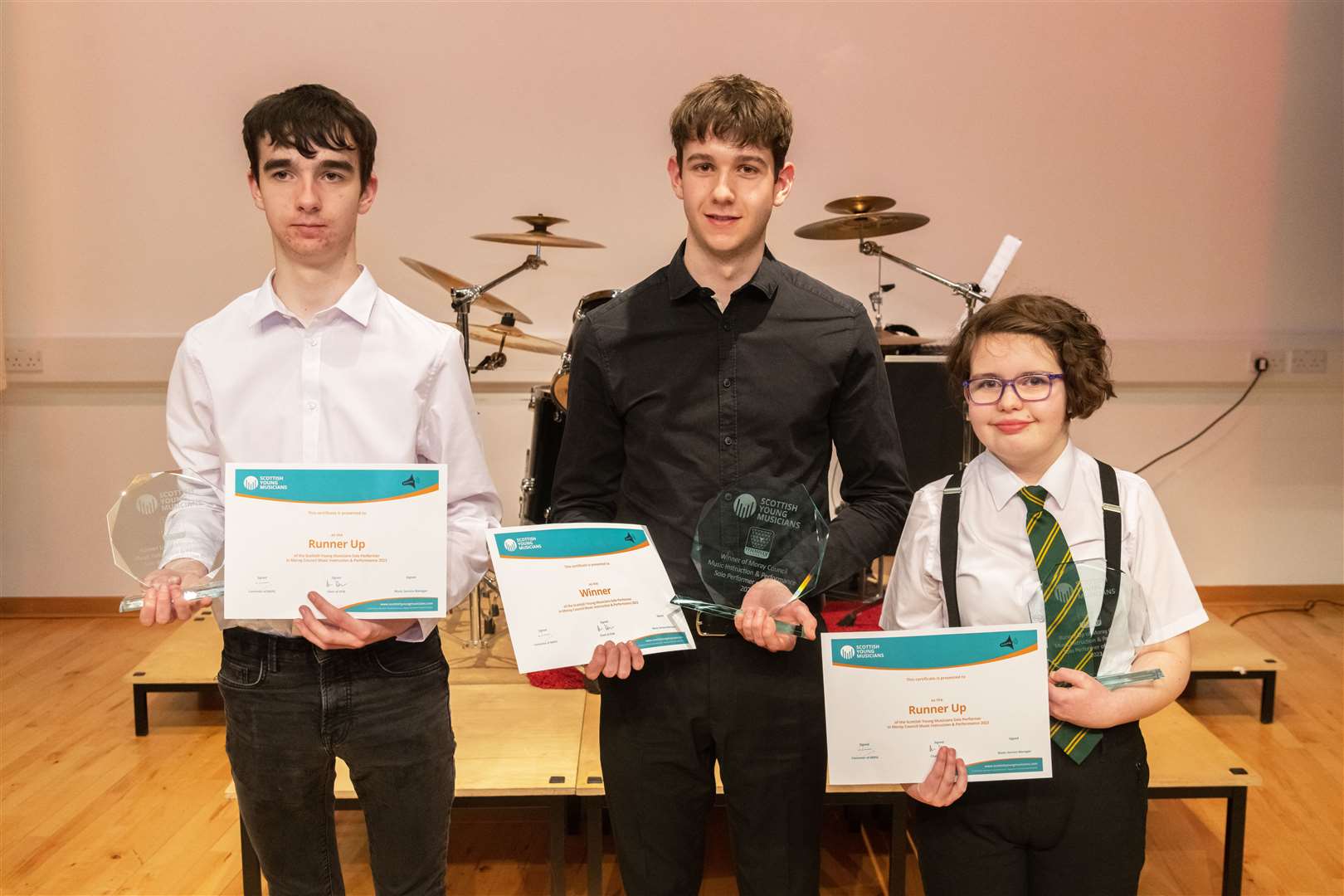 From left: Thomas Main, Edward Clark and Izzy MacPherson with their trophies at the Moray Young Musicians Competition Final held at Elgin Academy. Picture: Beth Taylor.