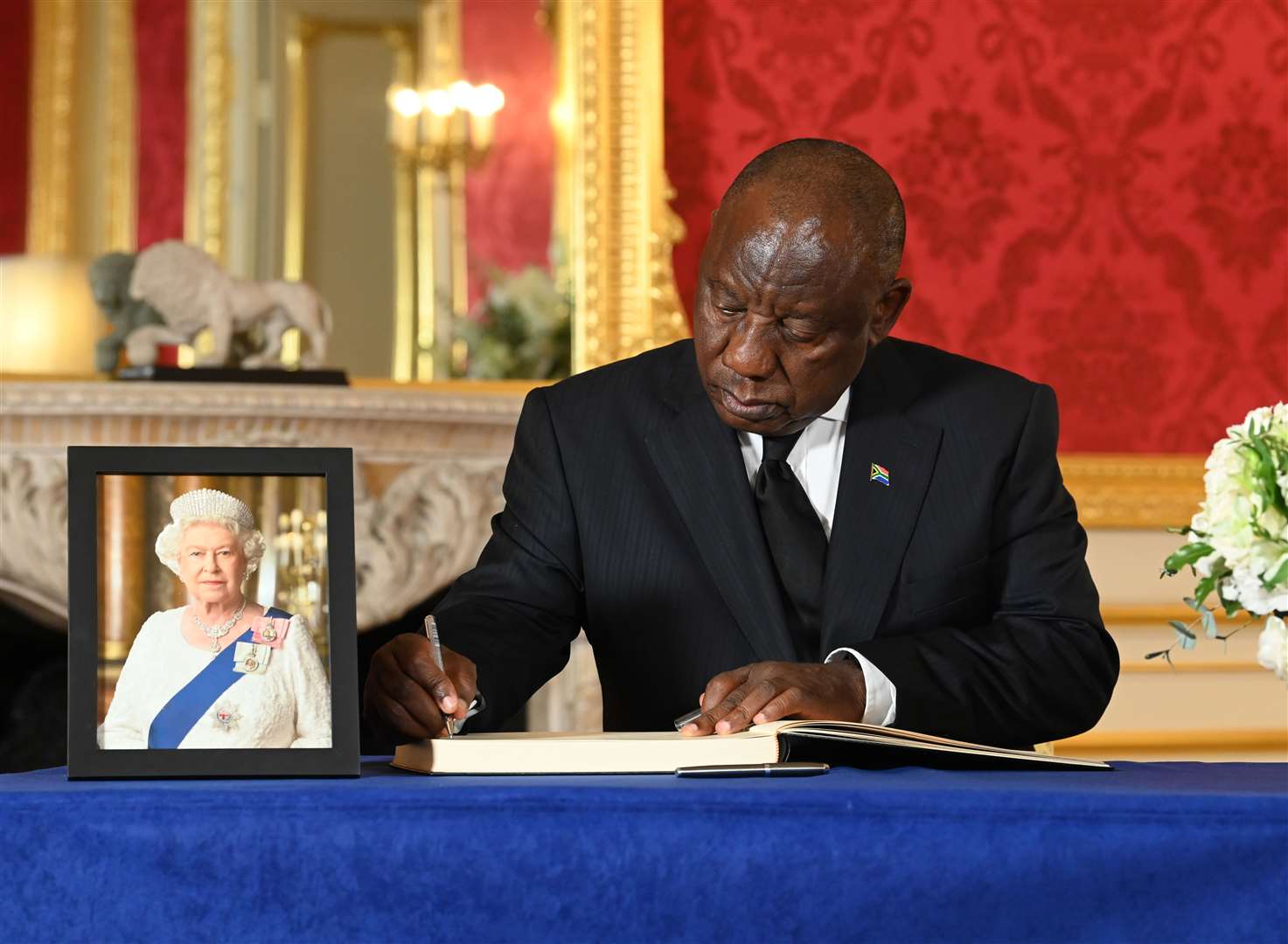 South African President Cyril Ramaphosa signing a book of condolence for Queen Elizabeth II (Jonathan Hordle/PA)