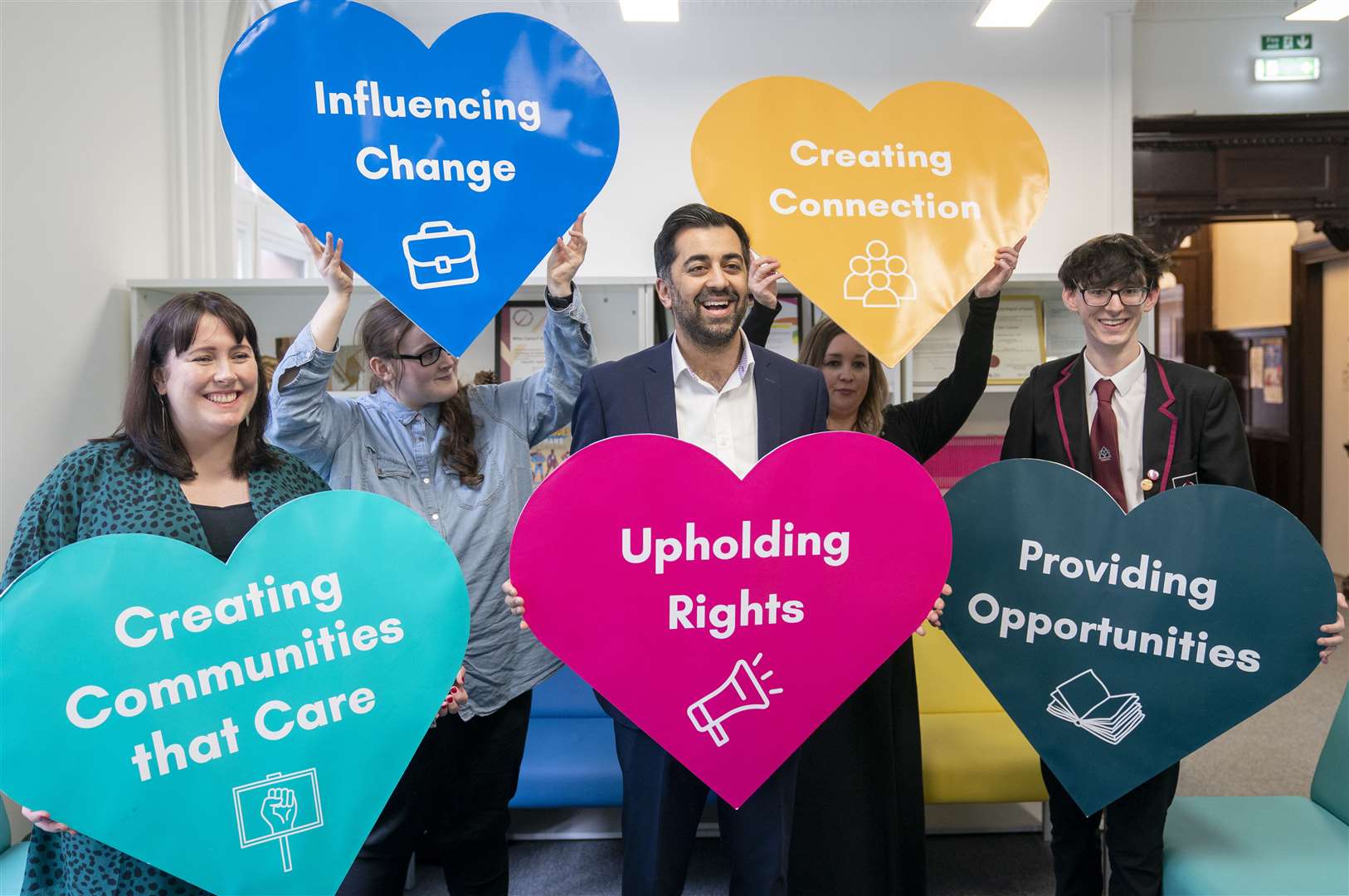 Humza Yousaf meets volunteers and care-experience members during a visit to Who Cares? Scotland in Glasgow (Jane Barlow/PA)