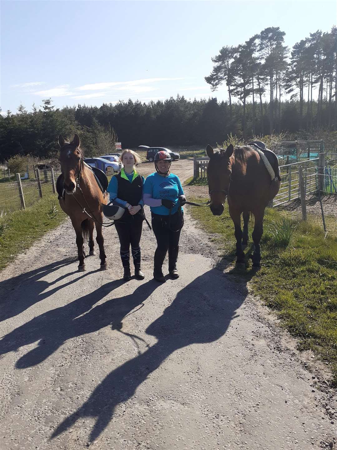 Imogen and Cheryll Hilton with horses Lucky and Tobias.