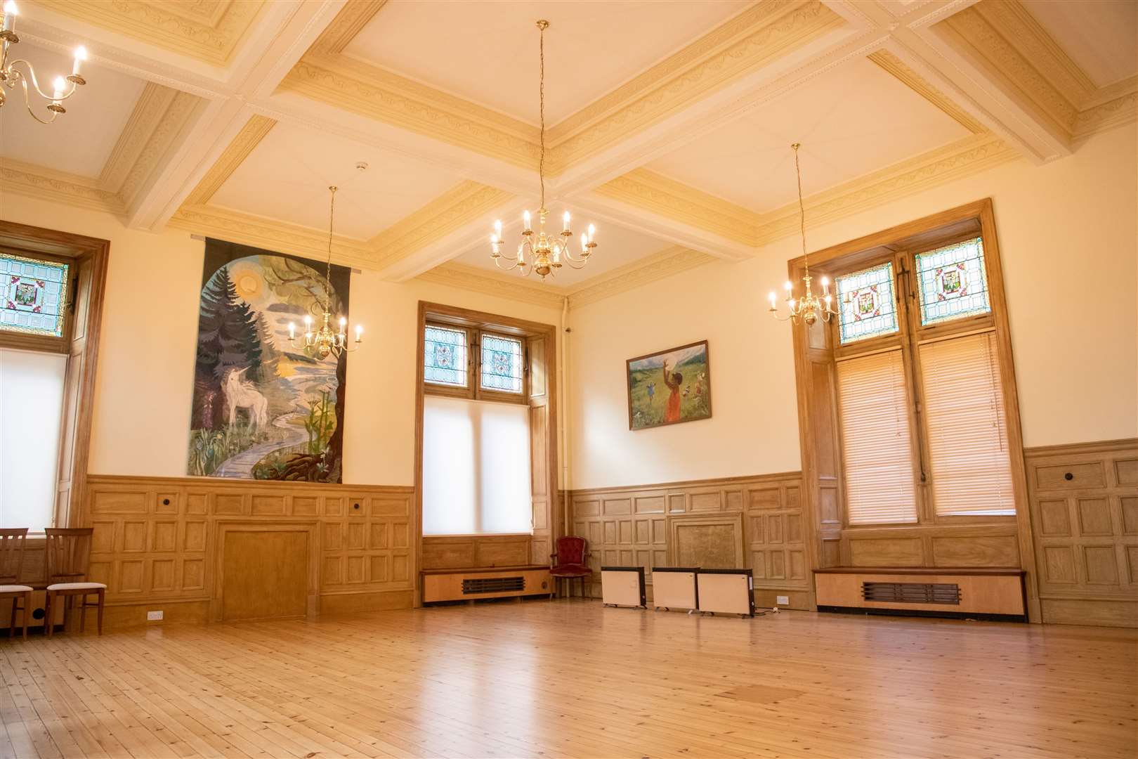 The immaculate ballroom still has its original wooden wall panelling and flooring.